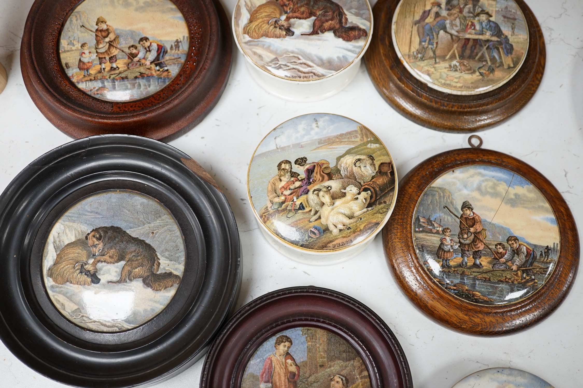 Eleven 19th century mostly framed pot lids including ‘The Snow Drift’, ‘War’, ‘High Life’, etc. Condition - mostly good, one cracked